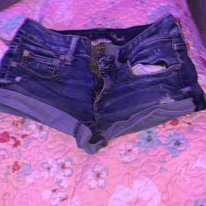 Ripped navy blue shorts